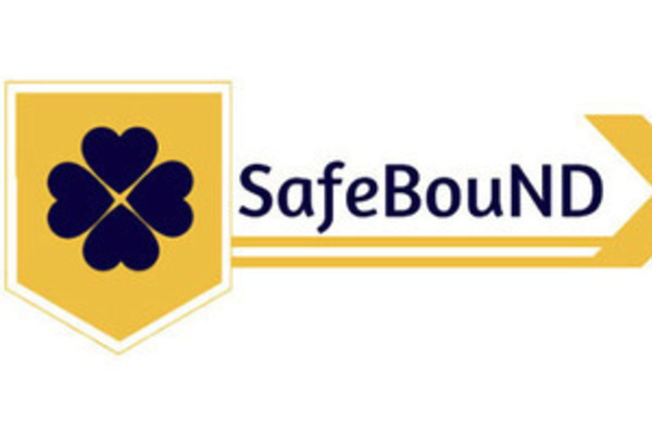 SafeBouND logo featuring a navy blue clover on a gold background